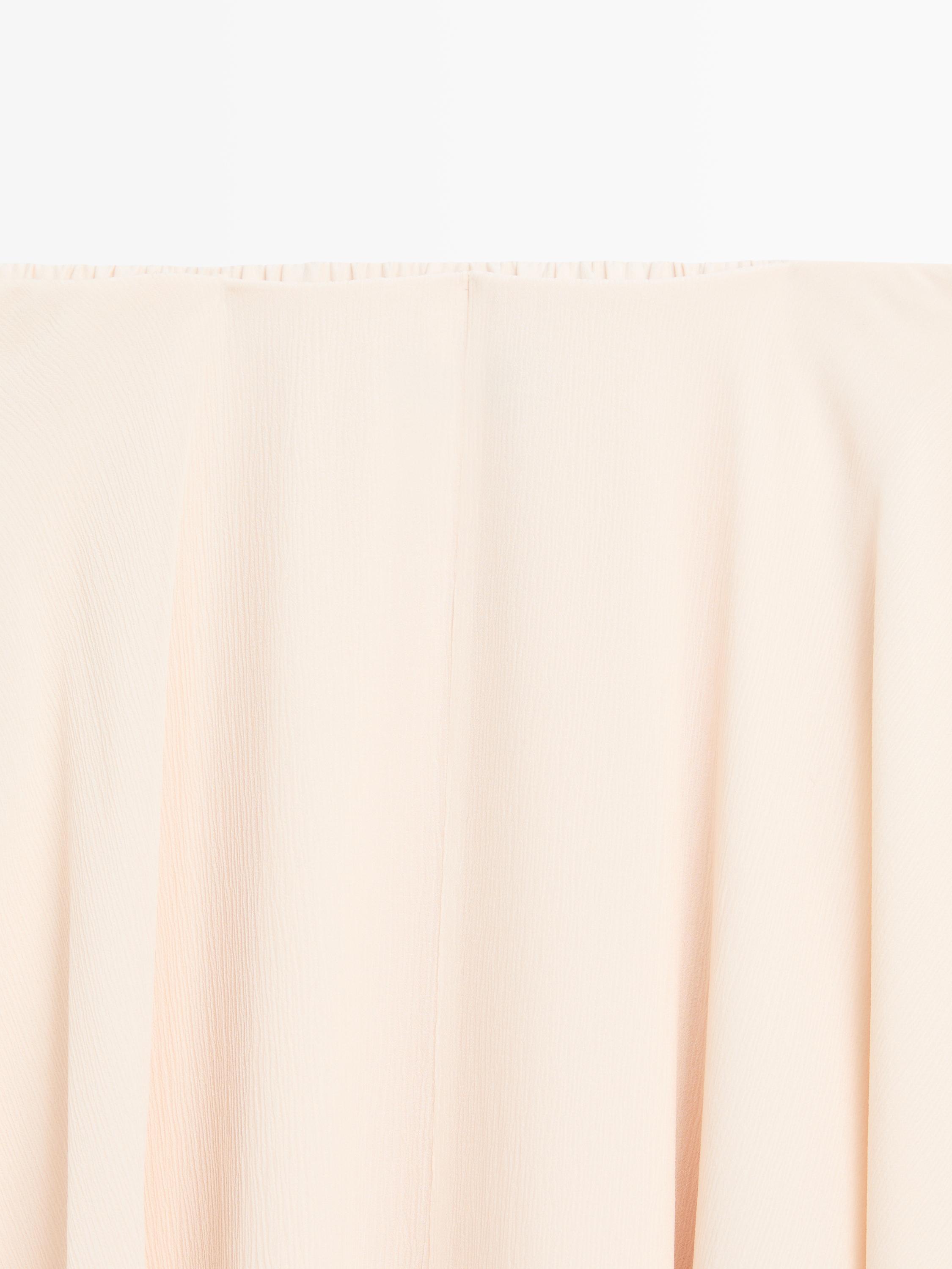 Flowing asymmetric midi skirt